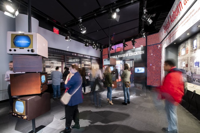 Adults view exhibits at National Center for Civil and Human Rights