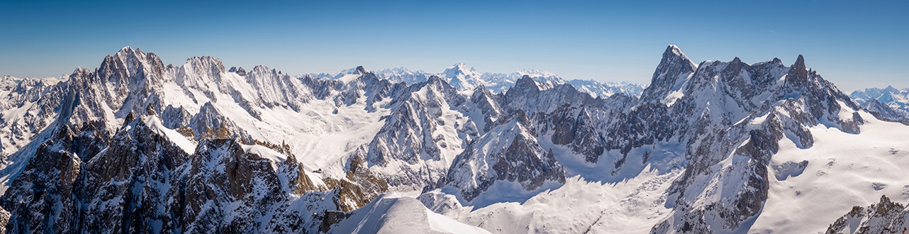 Panorama of snow capped peaks and glaciers in the French alps