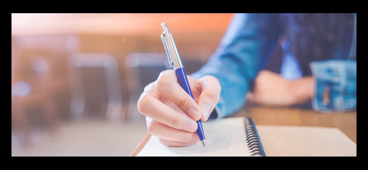 woman's hand with pen