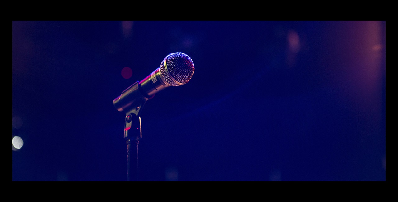 Microphone on stand with dark background