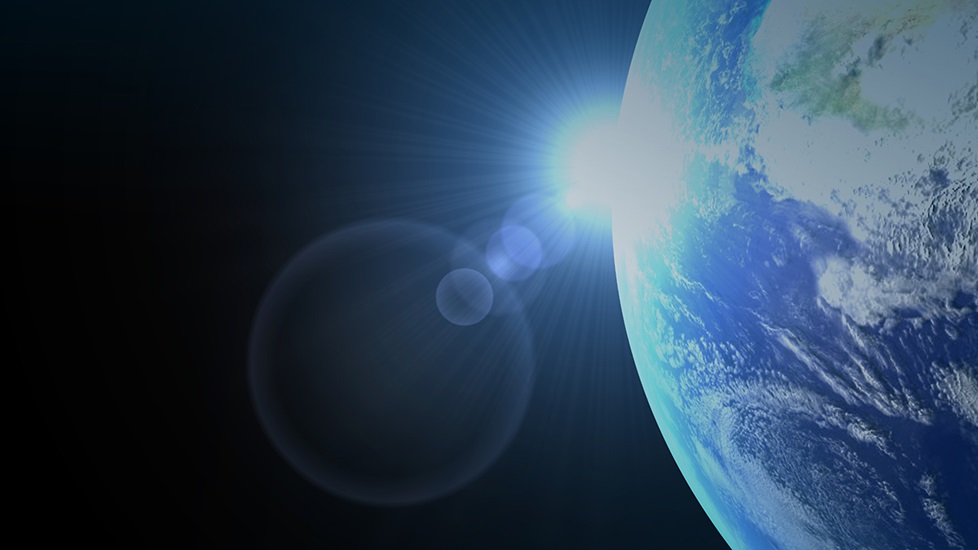 Artist's rendering of Earth in space with rising sun