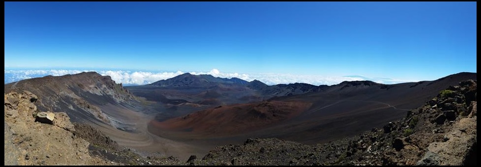 view over a volcanic crater with blue sky