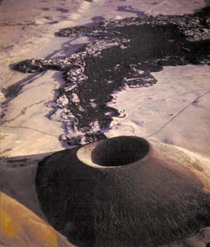 A cinder cone with basalt lava flow