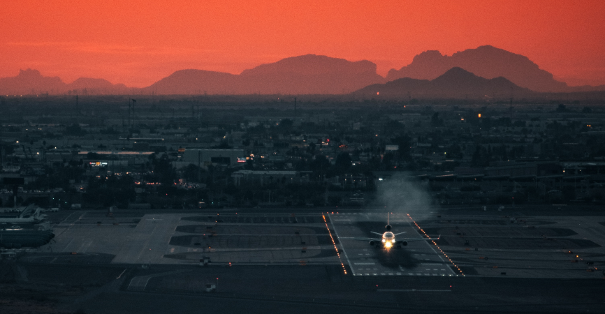 Phoenix airport with red sky and mountains in the background.