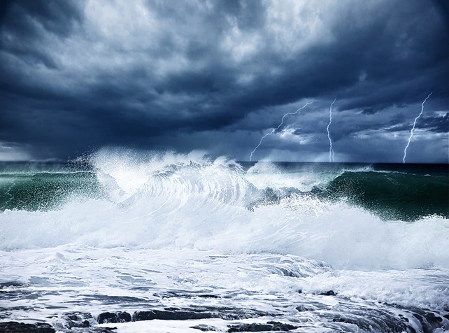 Thunderstorm and lightning on the beach with crashing waves