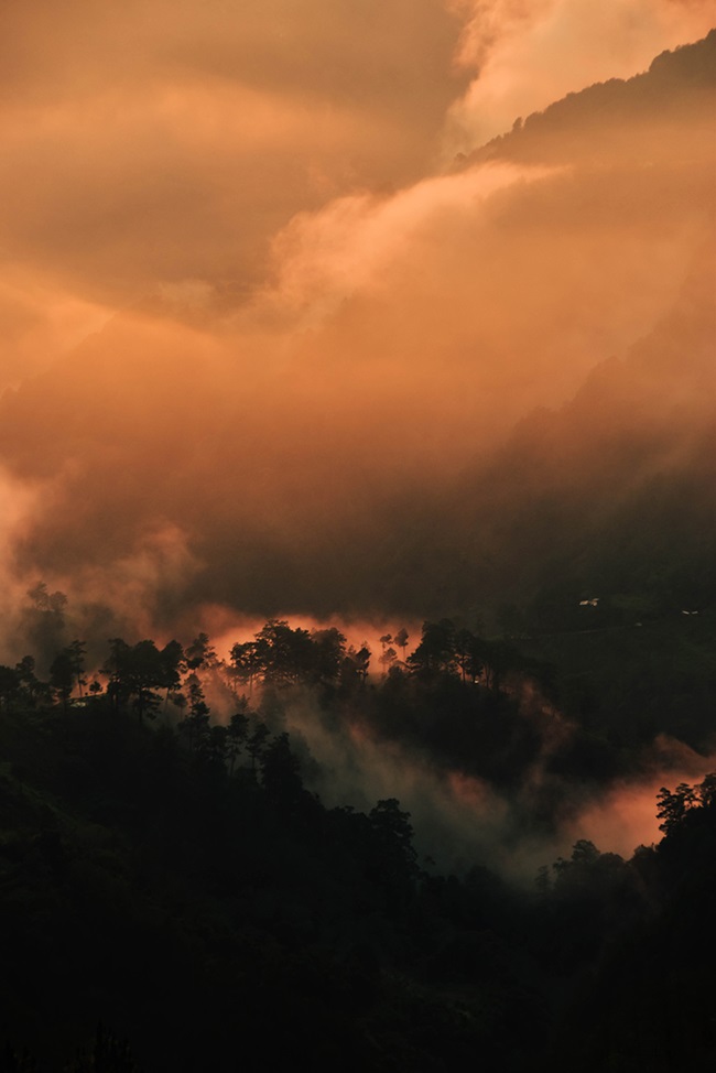 Rain clouds rolling over tropical mountains 