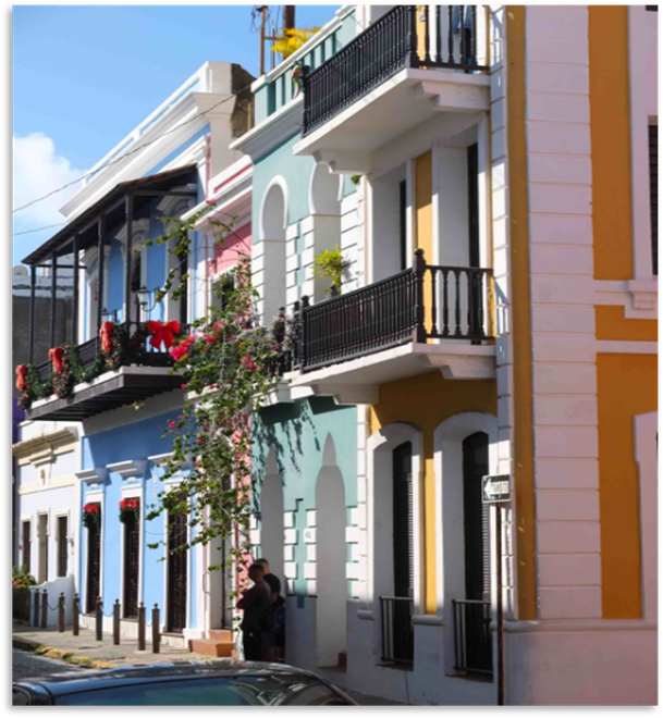 Street in old San Juan with colorful rowhouses and small balconies