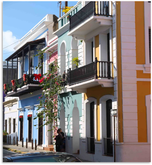 Street in old San Juan with colorful rowhouses and small balconies