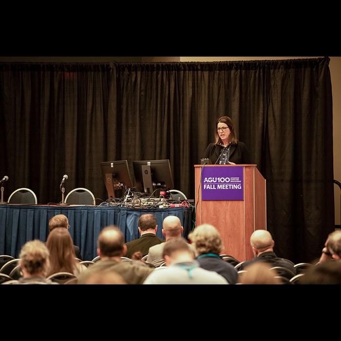 Woman speaks at a podium