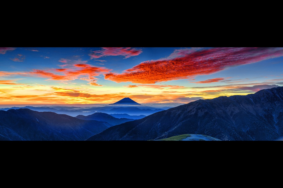 Mountains with colorful clouds and sky at dawn