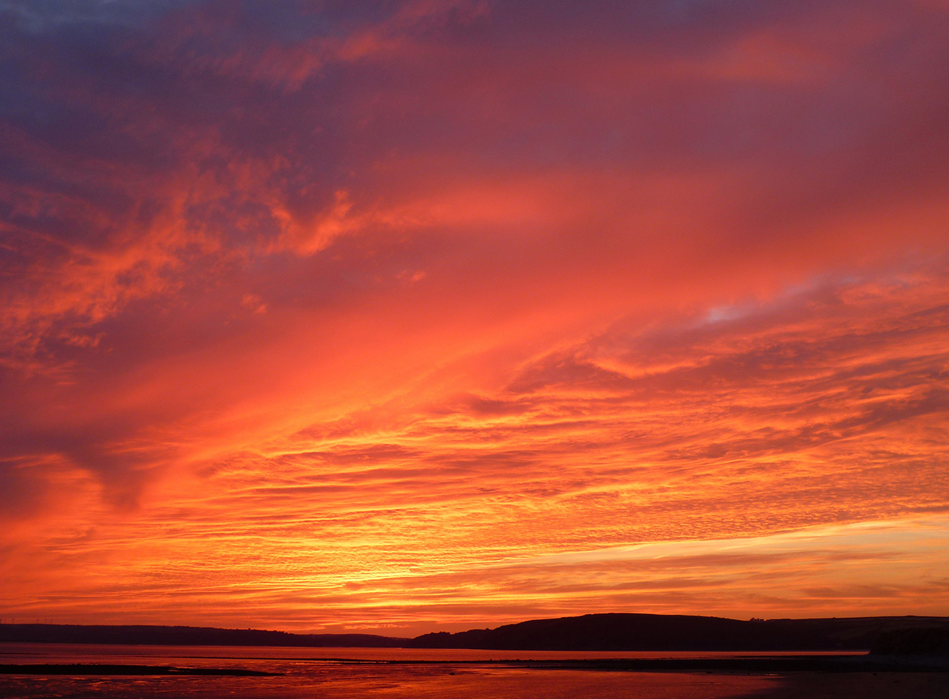 Cloudy sky with pink and orange hues