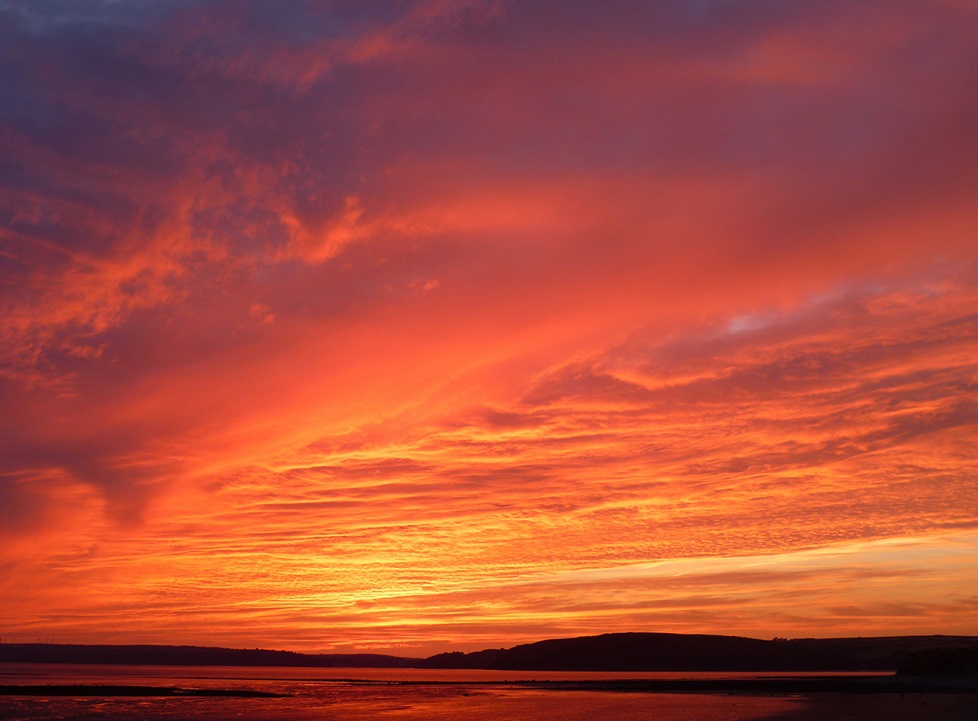 Cloudy sky with pink and orange hues
