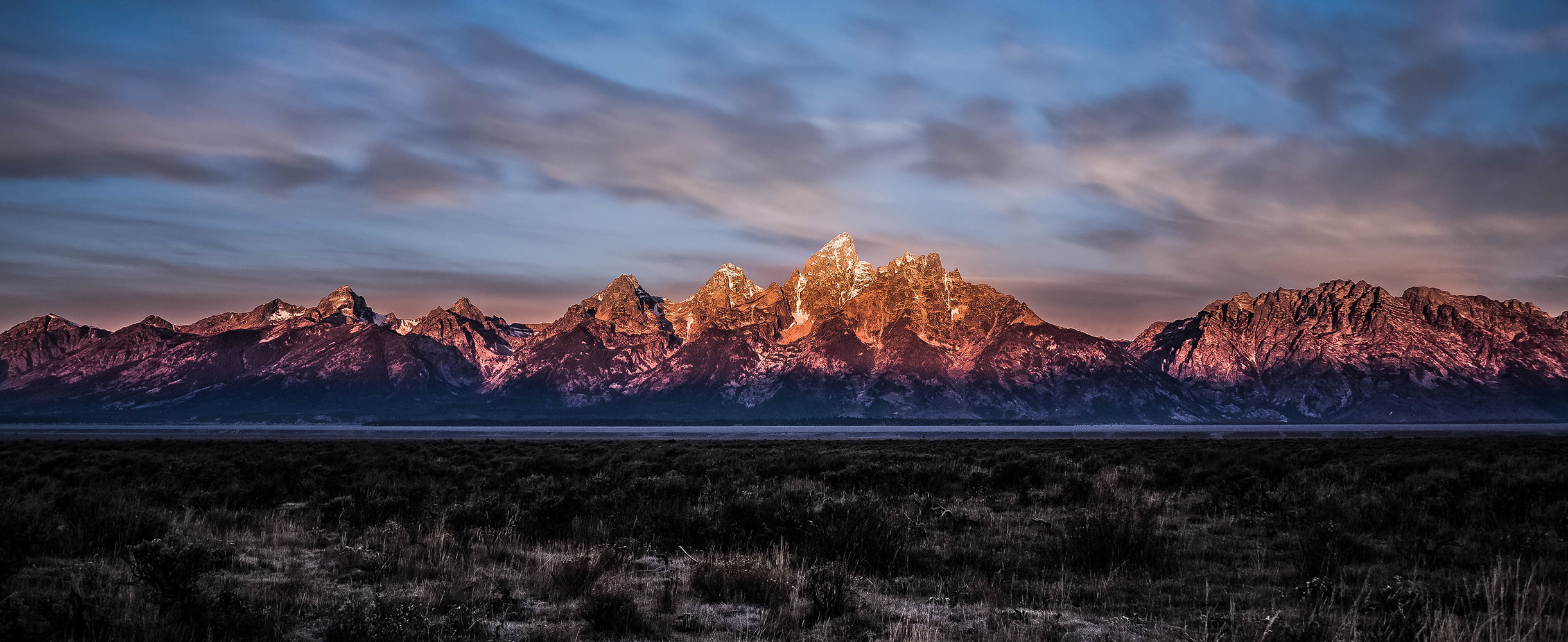 Panoramic view of mountains at sunset