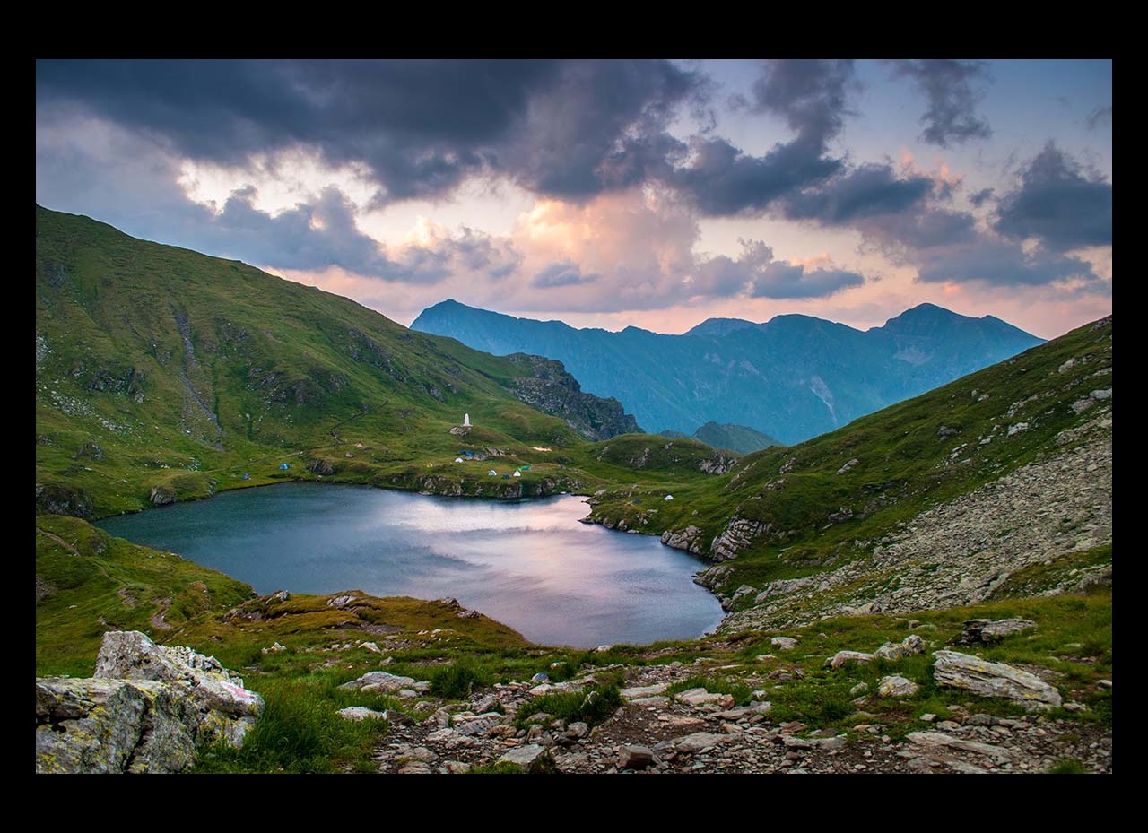 Lake on side of mountain in Romania