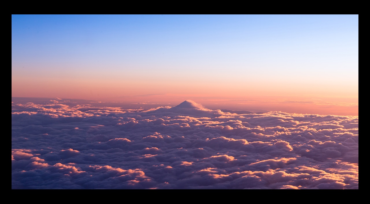 Sunrise over bed of clouds