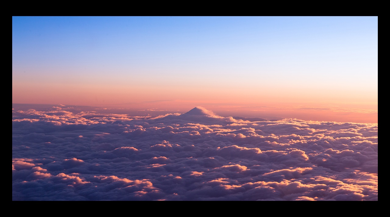 Sunrise over bed of clouds