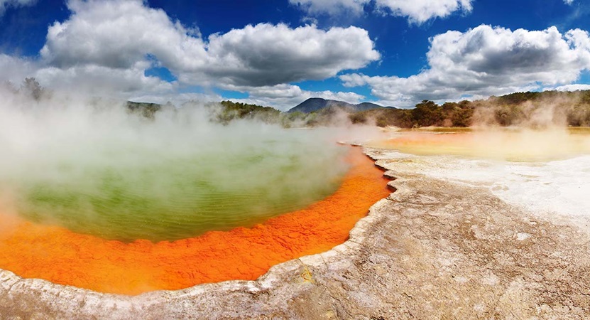 Hot thermal spring on sunny day in New Zealand