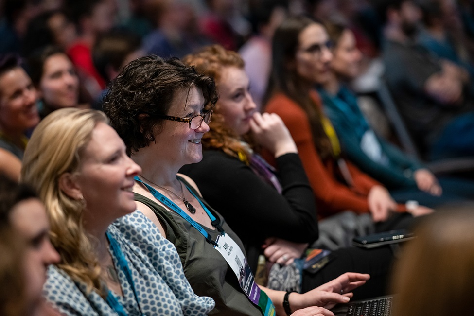 Women listening in crowd at Fall Meeting