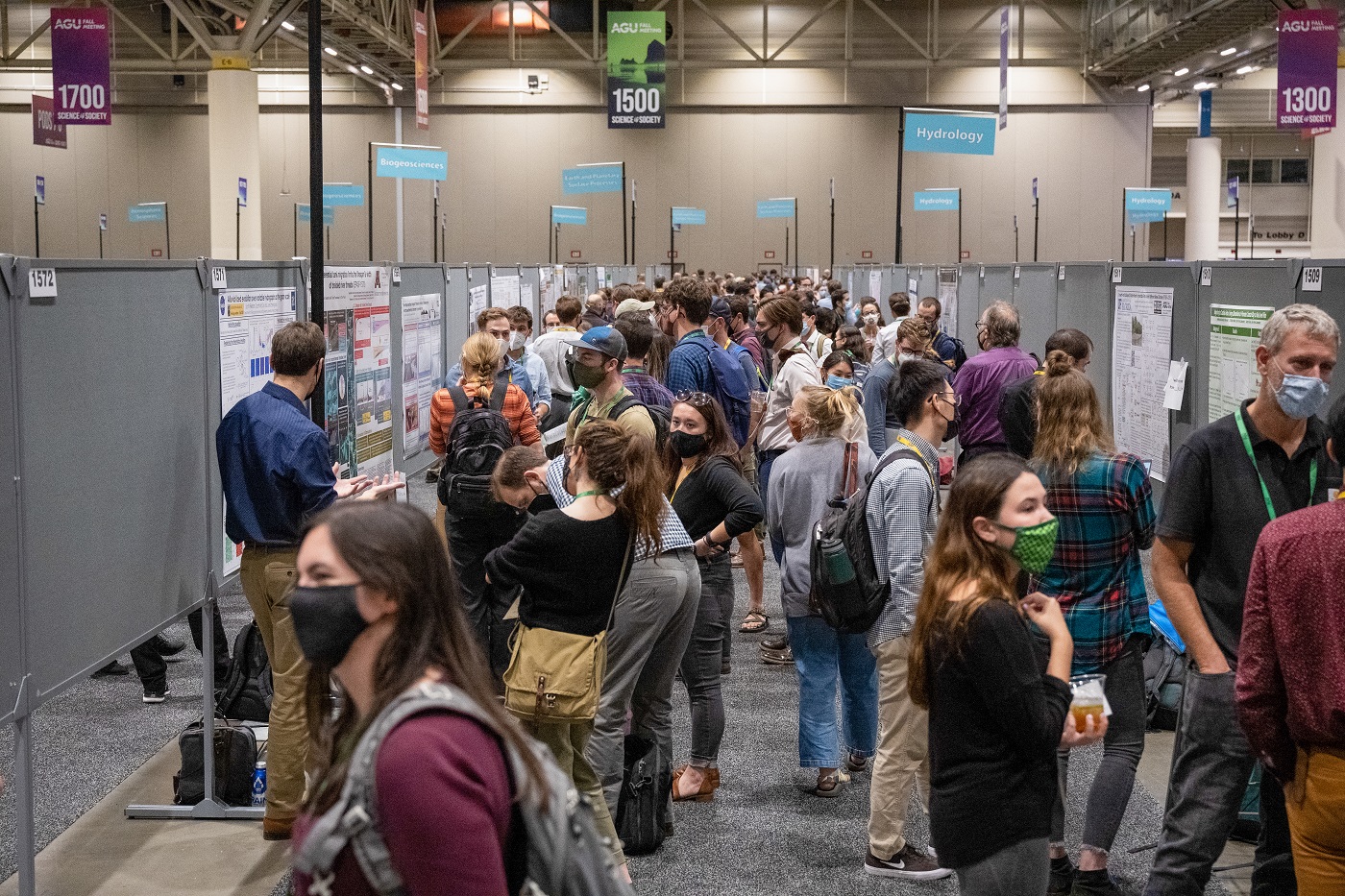  Attendees wear face masks in the crowded Poster Hall at Fall Meeting 2021