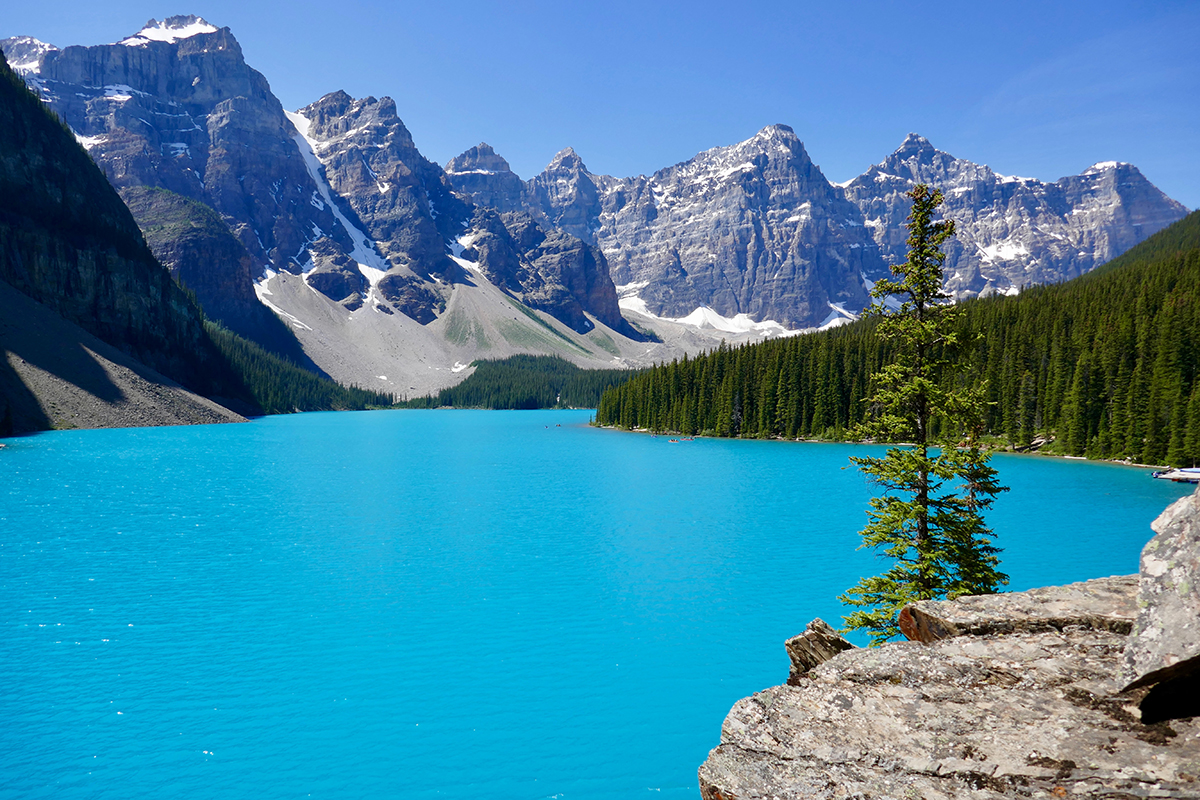 Teal lake with mountains in background, Canada