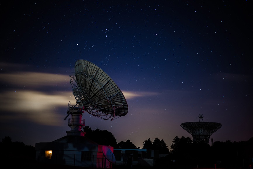 satellite dish under a starry sky