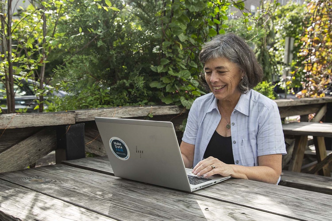 woman on laptop outdoors