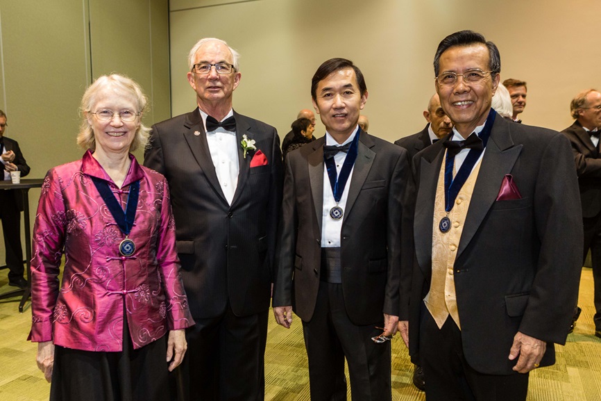 four awardees posing at the award ceremony