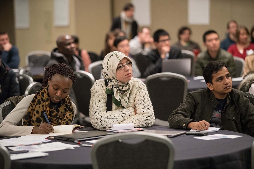 Students listening and writing in class