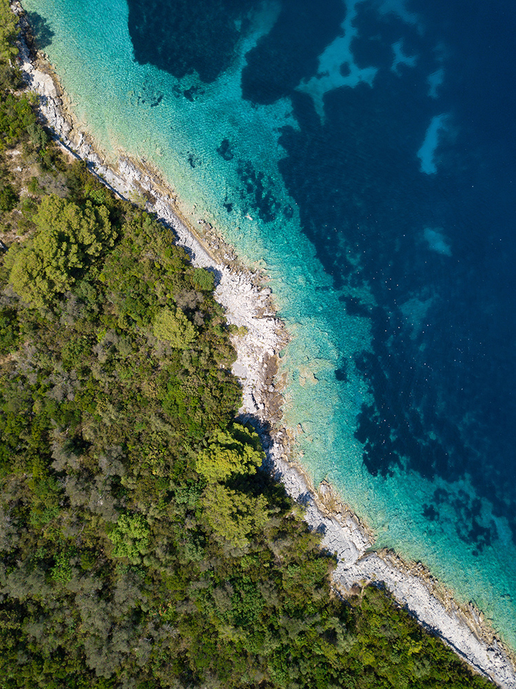 Aerial view of land, beach and water