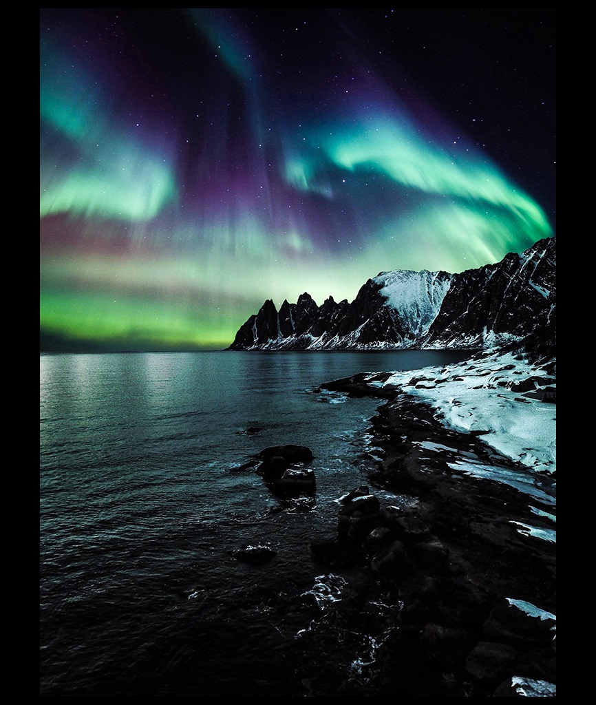 Aurora borealis over the lake in the evening