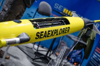 An exhibit of a yellow underwater glider with the word SEAEXPLORER 