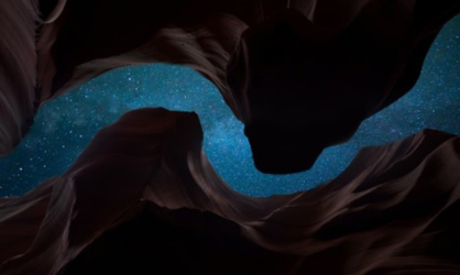 Night sky as viewed looking up from a canyon.