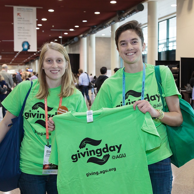 Attendees wearing and holding GIving Day t-shirts AGU general funds