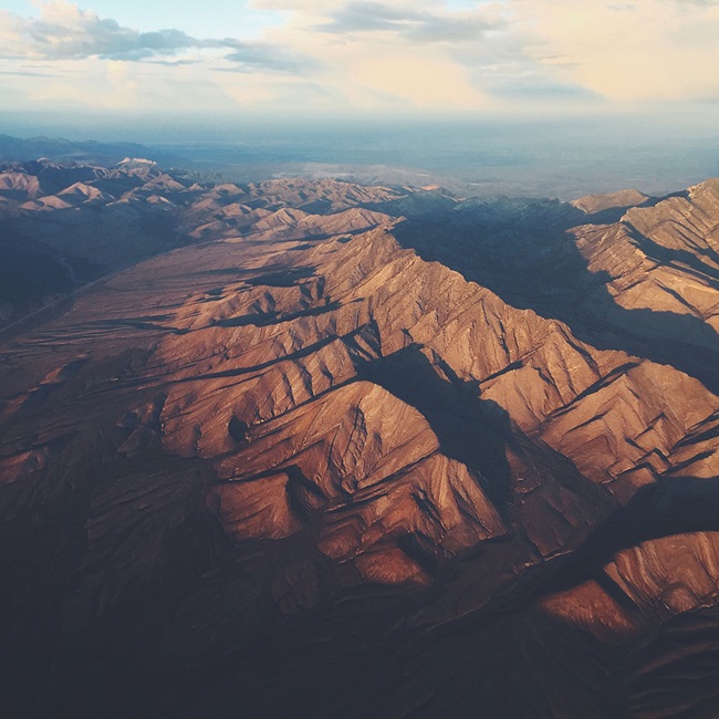 view from a plane of an arid mountain scape