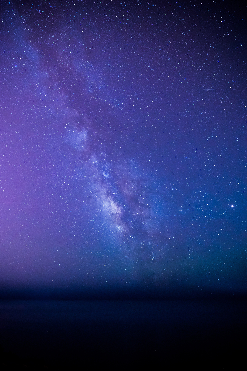 Purple gradient of night sky with stars