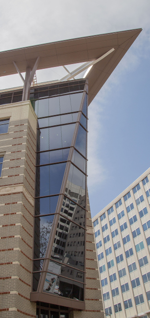 A photo looking up at the building's glass Prow