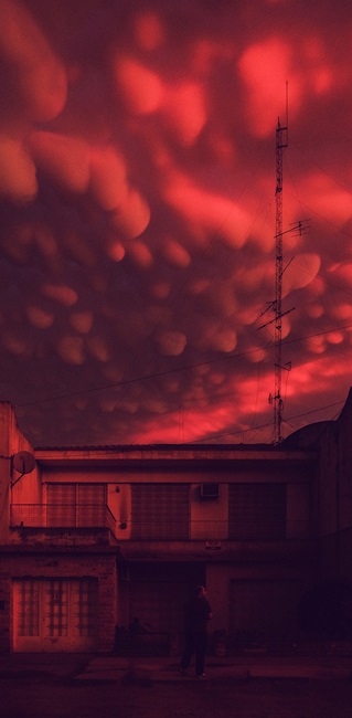 Pink cloud formation over building