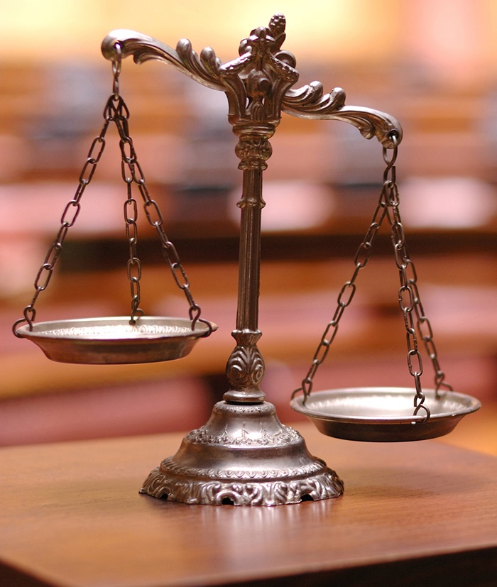 Scale on table in the empty courtroom