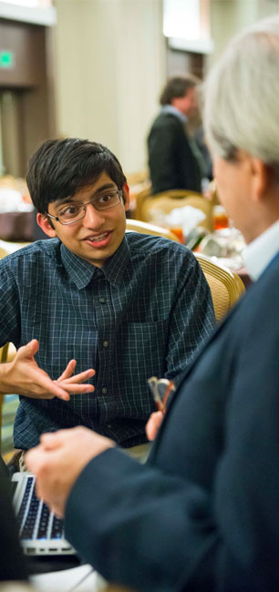 Boy talking to teacher